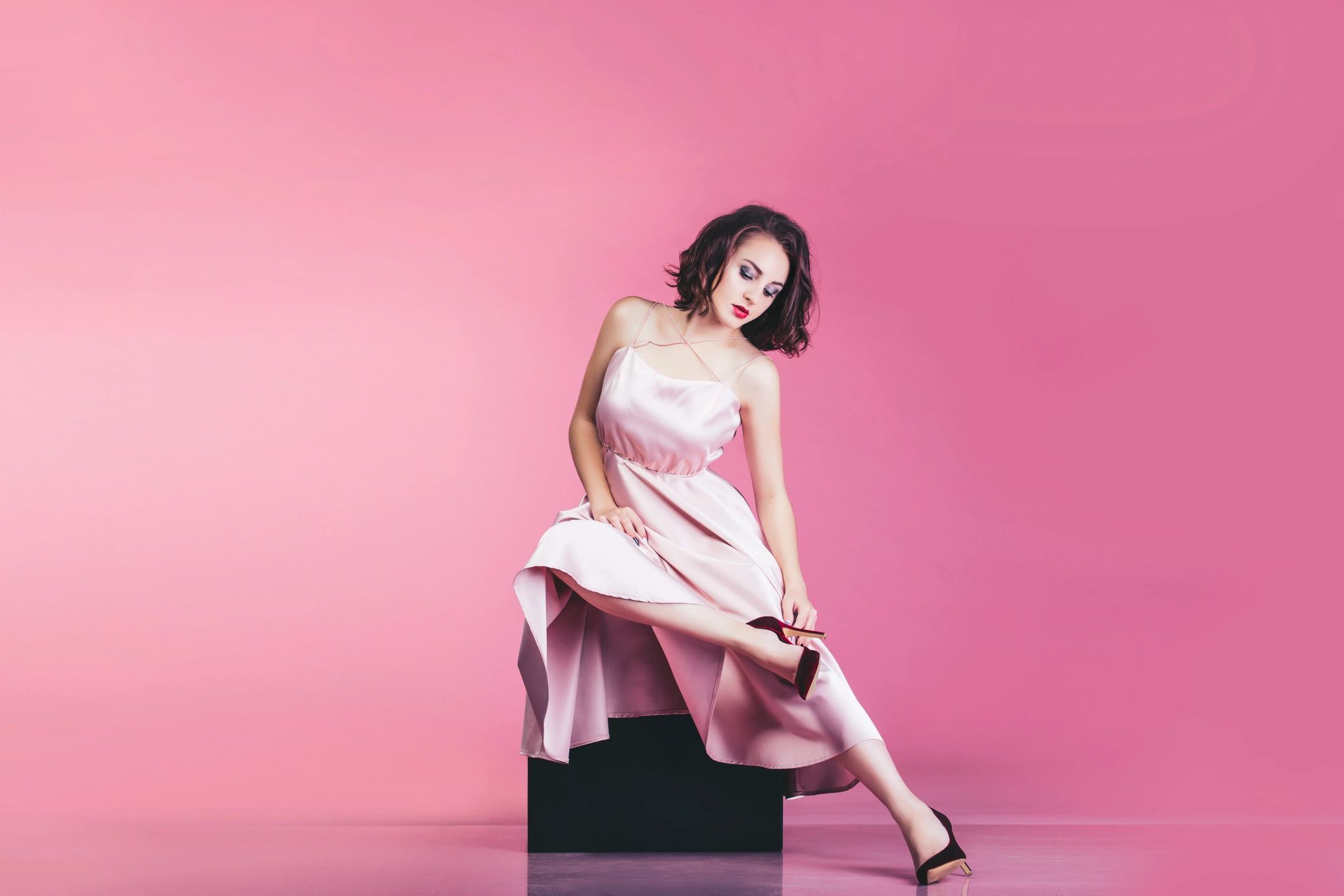 Elegant woman in pink dress, modern luxury